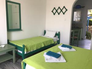 A bed or beds in a room at Studios Panorama Drios