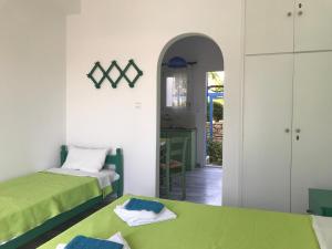 A bed or beds in a room at Studios Panorama Drios