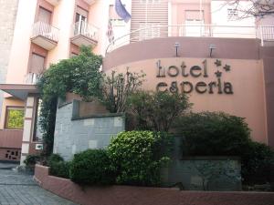 a hotel epidemic sign on the side of a building at Hotel Esperia in Genoa