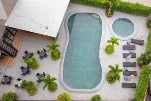 a rendering of a swimming pool at a resort at Golden Tulip Essential Pattaya in Pattaya North