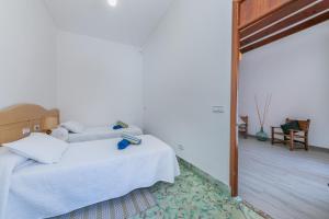 Postel nebo postele na pokoji v ubytování Holiday Home S'Arraval
