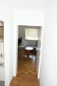 a hallway leading into a room with a table at Appartament im Herzen von Nürnberg in Nürnberg