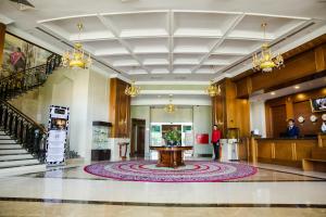 a lobby with a large rug on the floor at Diplomat Hotel by AG Hotels Group in Astana