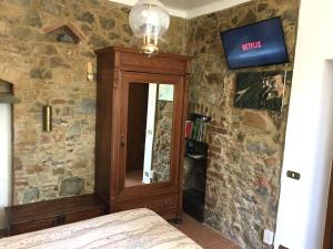 TV a/nebo společenská místnost v ubytování Casa Fabbrichina