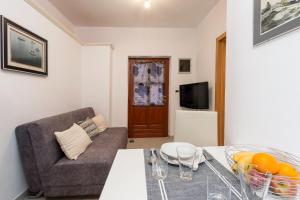 a living room with a couch and a table at Meri in Premantura