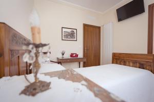 Postel nebo postele na pokoji v ubytování AgriB&B Corte Burchio