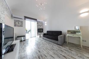 Televízia a/alebo spoločenská miestnosť v ubytovaní Amuri Holiday Apartment