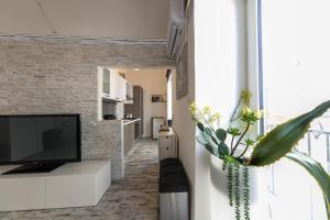 Televízia a/alebo spoločenská miestnosť v ubytovaní Amuri Holiday Apartment