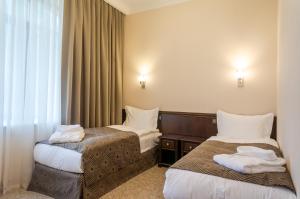 Ένα ή περισσότερα κρεβάτια σε δωμάτιο στο Royal Plus Hotel +20 φωτογραφίες