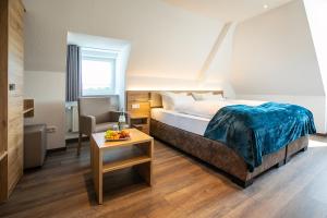Een bed of bedden in een kamer bij Landgasthof-Hotel Zum Steverstrand
