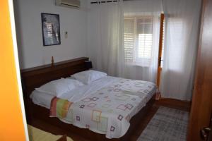 Postel nebo postele na pokoji v ubytování Apartman Linda