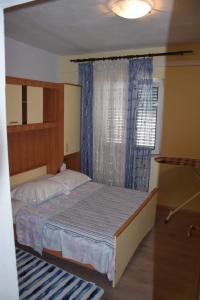 Postel nebo postele na pokoji v ubytování Apartman Linda