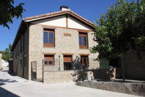 an old brick building with windows and a tree at Nekasenea II in Garísoain