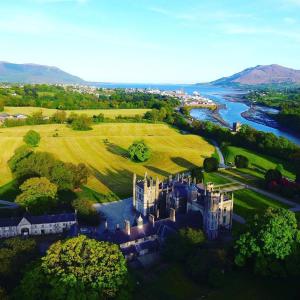 an aerial view of a castle next to a river at Narrow Water Castle Self Catering Accommodation in Warrenpoint