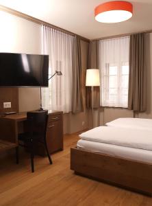 Postel nebo postele na pokoji v ubytování Hotel Bären