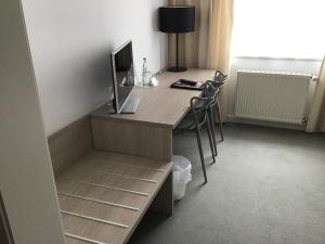 TV a/nebo společenská místnost v ubytování Garni Hotel Schmaus