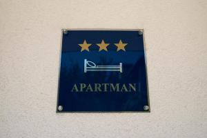 Certificato, attestato, insegna o altro documento esposto da Apartmani Malbašić