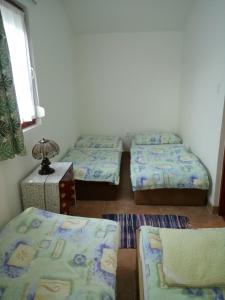 Postel nebo postele na pokoji v ubytování Apartmány Denis