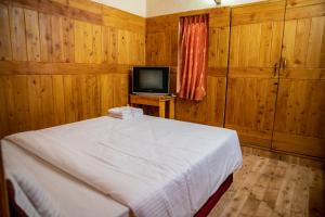 TV a/nebo společenská místnost v ubytování JJS Cottages