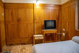 TV a/nebo společenská místnost v ubytování JJS Cottages + 11 fotografií