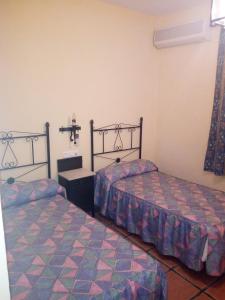 Ένα ή περισσότερα κρεβάτια σε δωμάτιο στο La Posada de Eustaquio