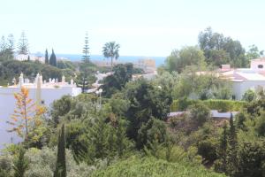 a view of a city with trees and buildings at Casa do Milho in Carvoeiro