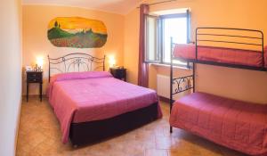 Ένα ή περισσότερα κρεβάτια σε δωμάτιο στο Agriturismo Ferrari