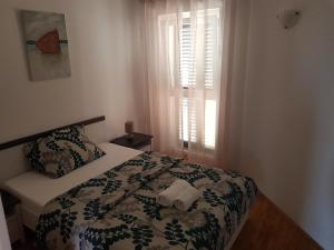 Postel nebo postele na pokoji v ubytování Apartment Doris