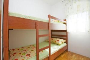 Postel nebo postele na pokoji v ubytování Apartments and Rooms Mišić