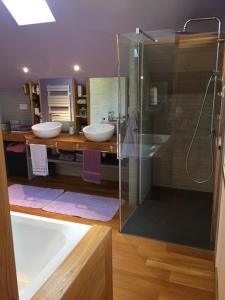 a bathroom with two sinks and a shower at La Maison des Coeurs in Attignat-Oncin +35 photos