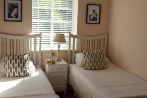 Кровать или кровати в номере Kandelaars Cottage