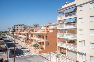 an apartment building with balconies and a street at Ideally Located Holiday Apartment in Moncófar