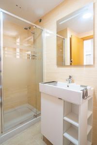 a bathroom with a sink and a shower at Ideally Located Holiday Apartment in Moncófar +13 photos