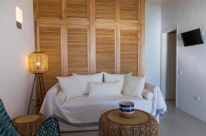 Кровать или кровати в номере Astarte Luxury Apartments