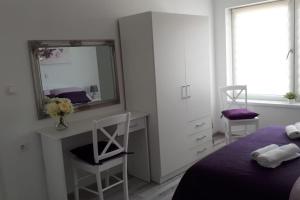Postel nebo postele na pokoji v ubytování Apartman Lidija
