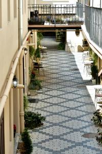 an empty courtyard with tables and chairs on a building at Safrano Palace in Braşov