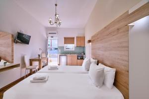 Posteľ alebo postele v izbe v ubytovaní Emmanouela's Apts