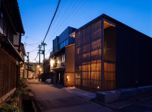 a small building on the side of a street at night at Gunjo no Tsuki in Kanazawa