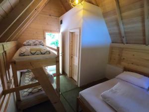 Postel nebo postele na pokoji v ubytování TARA INN Resort