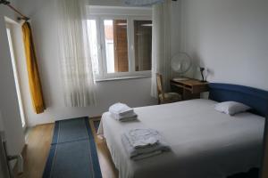 Postel nebo postele na pokoji v ubytování Apartment Sailor