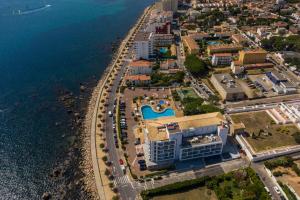 an aerial view of a resort next to the water at RVHotels Nieves Mar in L'Escala
