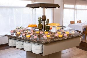 a buffet with food and drinks on a table at RVHotels Nieves Mar in L'Escala