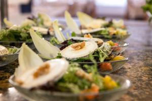 a group of plates of food on a table at RVHotels Nieves Mar in L'Escala