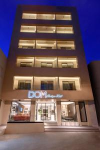 
a large building with a large window in front of it at DOM Boutique Hotel in Heraklio Town
