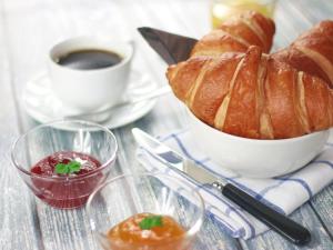 a table with a bowl of bread and a cup of coffee at le terme sotto casa 2 free in Rapolano Terme