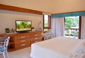 Un pat sau paturi într-o cameră la Bella Ilha Pousada