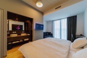 Postel nebo postele na pokoji v ubytování WUD hotel