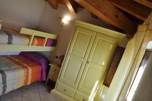 a bedroom with a bunk bed and a bunk room with a bunk bed at B&B Casa Ghiani in Ìsili