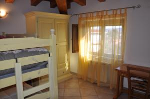A bed or beds in a room at B&B Casa Ghiani