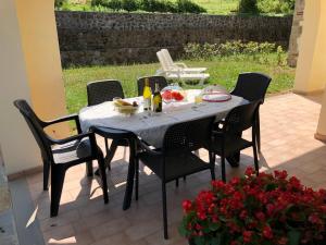 a table with food on it on a patio at Casa Elena in Camporgiano